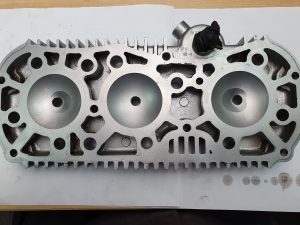 Vapour blasted cylinder head showing clean fluid galleries