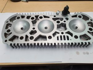 Vapour blasted cylinder head showing clean combustion chambers